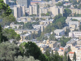 mandatory solar water heaters atop apartment buildings in Haifa-zoom in to see them