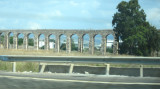 Roman aqueduct runs along the highway