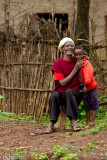 This gentleman ran into his house to bring out a stool so he could sit for us to take his picture. He looked very happy.