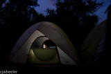 Vaughn in his tent downloading pictures