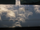 Projection of partial phase on side of van...with the help of some well-positioned trees