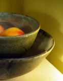 Apples and Bowls in the setting Sun