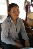 Woman in village, preparing rattan