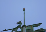 Peregrine: on weathervane top bulb facing west/looking south