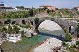 Albanians enjoying the clear water beneath the bridge