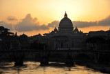 The sun disappears behind the dome of St. Peters Basilica