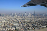 Flying along Jumeirah Beach with the towers of Sheikh Zayed Road