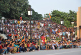 The crowd of Indian spectators - foreigners and VIPs get seated closer to the fence