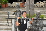 Dennis with the coolie sculpture in front of Asian Civilizations Musem