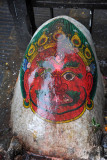 Painted stone at Swayambhunath wet with the rain