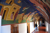 Mural lined passageway in the upper level of Kykkos Monastery