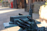 The Bishop holds a model of Coventry Cathedral
