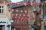 Danish flags flying over the pedestrian zone of Helsingr