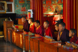 Monks chanting inside the main prayer hall