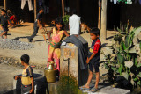 Nepali children around the public water tap, Mahadevabesi