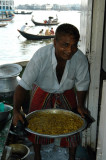 The cook on one of the big boats preparing a meal (with river water)
