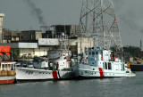 Bangladeshi Coast Guard CGS Tanveer (P614) on the left, a former Chinese vessel of the Shanghai II class