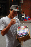 Vietnamese guy selling pirated books on the streets of Hanoi