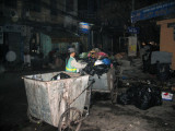 Municipal workers collecting garbage in the Old Quarter, keeping it surprisingly clean