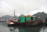 Walmart boat pulled up alongside a fishing boat, Cat Ba Harbor