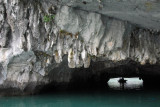 The cave opens up to the hollow center of a limestone island filled with a lagoon