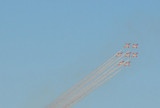 Six-aircraft formation of the Patrulla guila (Eagle Patrol) trailing smoke over Barcelona