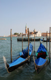 A pair of gondolas in front of the Doges Palace