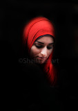 Young woman in shadow with hijab