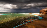 Bilgola Beach rockpool with approaching storm