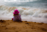 Little girl watching the surf at Palm Beach