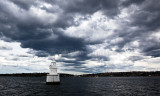 Sydney Harbour marker with approaching stormclouds