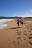 Couple walking on beach at Palm Beach, Sydney 