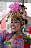 Vietnamese dancer in colourful dress and headress