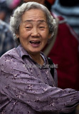 Laughing Asian lady at Lunar festival 