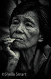 Pensive Asian lady in mono 