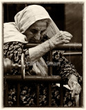 Lady fishing at Quay