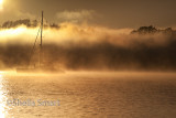 Yacht and rolling mist in Bay of Islands, New Zealand