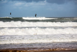 Kite surfers at Newport Beach amongst heavy surf
