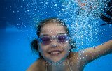 Little girl swimming underwater