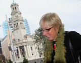 Lady in Aotea Square, with Town Hall in Background.