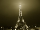 A foggy Eiffel Tower taken from the Bateaux Mouches boat tour.