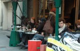 Outdoor cafes are crowded despite temperatures in the 40s F (~6 C)