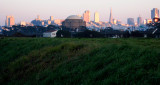 The hill grass was beautiful against city at dusk. 3184rc.