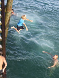 Zach, aged 6 jumping off the wharf