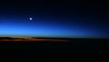 Sunrise and Moonrise (Waning Crescent) over North Pole 37,000 ft