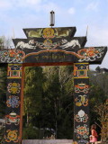 Arch gate leading to footbridge, Trongsa Dzong, Bhutan