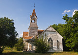 A side view  of the First Presbyterian church  in Bartlett, TX showing the crooked steeple.