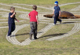 Three small boys inventing a game