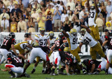 Jackets defense attempts to block a field goal by Bulldogs K Ryan Gates