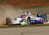 Lola B06/10 AER slides across turn 5 after smacking the inside wall